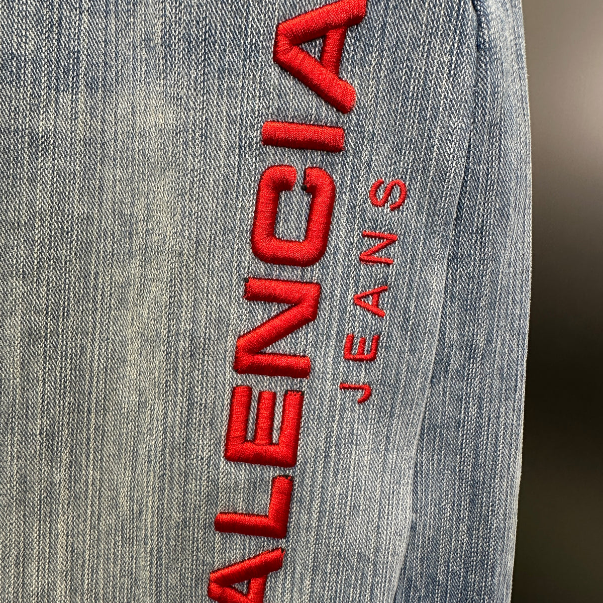 Balenciaga Light Wash Baggy Jeans with Red Side Logo