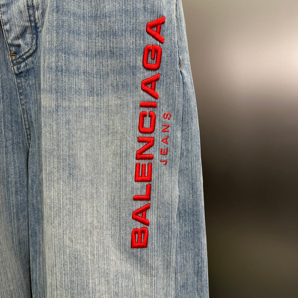 Balenciaga Light Wash Baggy Jeans with Red Side Logo