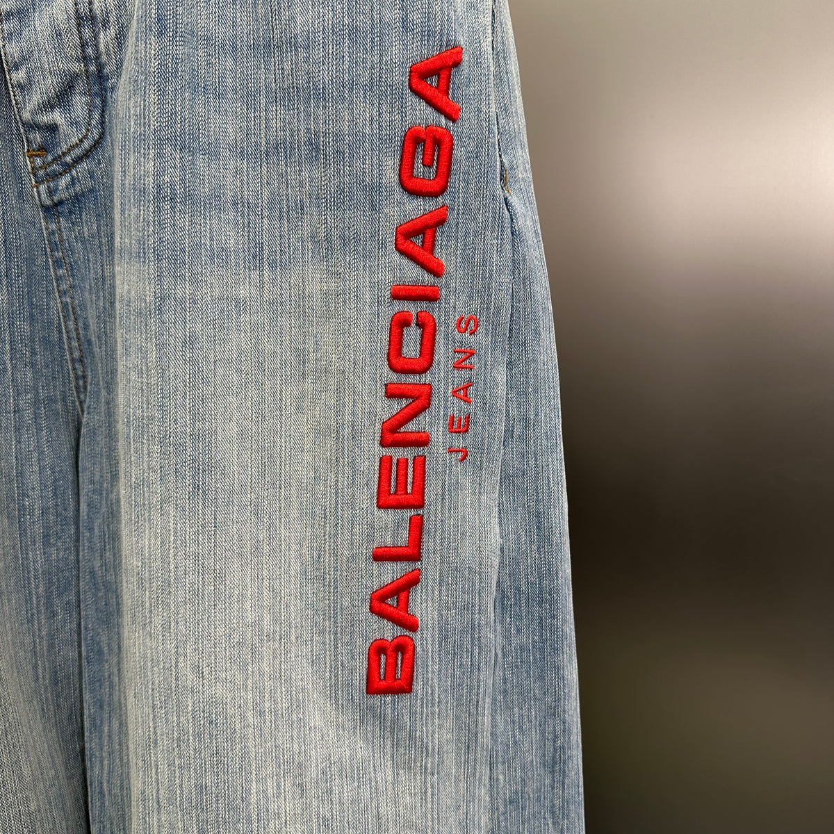 Balenciaga Light Wash Baggy Jeans with Red Side Logo