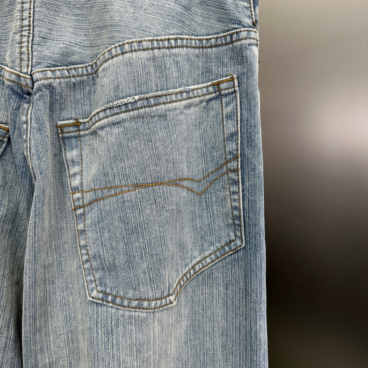 Balenciaga Light Wash Baggy Jeans with Red Side Logo