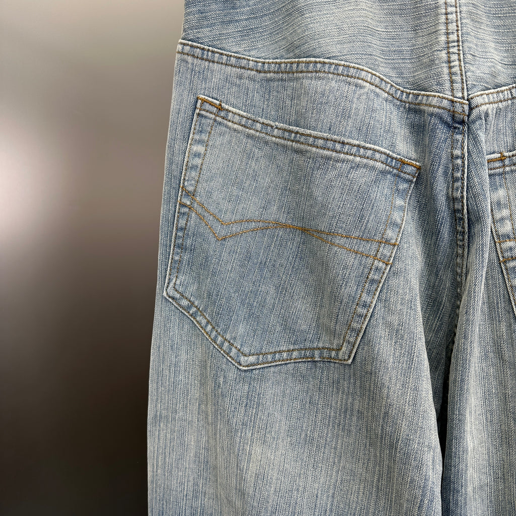 Balenciaga Light Wash Baggy Jeans with Red Side Logo