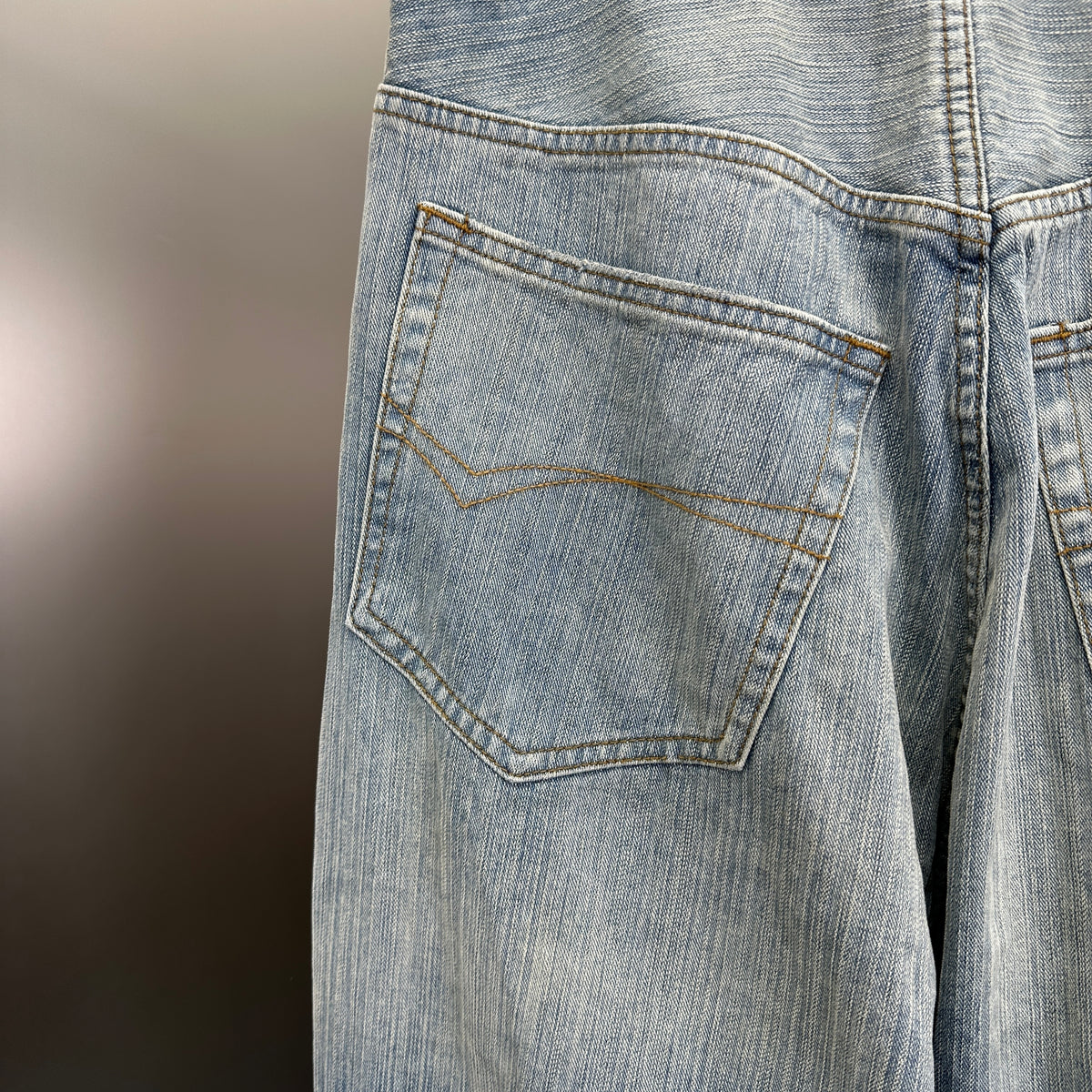 Balenciaga Light Wash Baggy Jeans with Red Side Logo